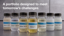 BASF concrete admixtures portfolio displayed in laboratory jars, including Vinapor, SureStar, HyCon, Starvis, and Melflux products.
