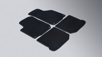 A set of four summer car mats on white background. A set of four summer car mats on white background.