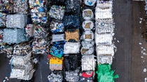 Aerial view of sorted plastic waste ready for shipping and recycling. Aerial view of sorted plastic waste ready for shipping and recycling.
