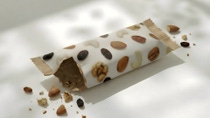 Empty cereal bar with some crumbs around the packaging 