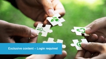 Four hands each holding a puzzle piece with eco-friendly symbols, against a green background. Four hands each holding a puzzle piece with eco-friendly symbols, against a green background.