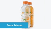 Two clear plastic bottles with orange caps containing natural orange juice, labeled ‘Orange 100% Natural,’ with a blue ‘Press Release’ banner overlay.
