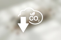 Icon on blurred background featuring a cloud-like form with "CO2" in the center and an arrow pointing downwards    