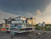 Modern multi-level building with large windows and varied geometric shapes against a sunset sky. Empty paved area with scattered rocks in the foreground.
NEST innovation and research building in Dübendorf, Switzerland, featuring upcycling solutions inside the STEP2 unit. Credit: Zooey Braun Modern multi-level building with large windows and varied geometric shapes against a sunset sky. Empty paved area with scattered rocks in the foreground.
NEST innovation and research building in Dübendorf, Switzerland, featuring upcycling solutions inside the STEP2 unit. Credit: Zooey Braun