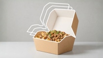 Paper-based packaging container with loaded fries; white lines behind the packaging indicate the different material layers
