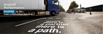 Semi-truck on an asphalt road with text reading "Where there is a partner, there is a path." Promoting asphalt durability for road construction. Semi-truck on an asphalt road with text reading "Where there is a partner, there is a path." Promoting asphalt durability for road construction.