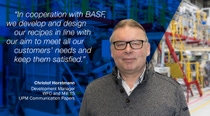 The image shows a man wearing a grey sweater over a collared shirt, positioned on the right side of the picture. In the background you can see a pilot coating center. On the left side, there is a blue overlay behind white text featuring a quote:
"In cooperation with BASF, we develop and design our recipes in line with our aim to meet all our customers needs and keep them satisfied."
Below the quote, the name and title are displayed:
"Christof Horstmann, Development Manager, WFC and Mill TS, UPM Communication Papers." The image shows a man wearing a grey sweater over a collared shirt, positioned on the right side of the picture. In the background you can see a pilot coating center. On the left side, there is a blue overlay behind white text featuring a quote:
"In cooperation with BASF, we develop and design our recipes in line with our aim to meet all our customers needs and keep them satisfied."
Below the quote, the name and title are displayed:
"Christof Horstmann, Development Manager, WFC and Mill TS, UPM Communication Papers."