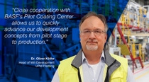 The picture shows a man wearing a light blue striped shirt and a yellow safety vest with a gray collar. He is standing in the pilot coating center. On the left side of the image, there is a blue overlay with a white text quote that reads: "Close cooperation with BASFs Pilot Coating Center allows us to quickly advance our development concepts from pilot stage to production."
Below the quote, the name and title of the person are displayed: Dr. Oliver Köthe. Head of Mill Development UPM Plattling. The picture shows a man wearing a light blue striped shirt and a yellow safety vest with a gray collar. He is standing in the pilot coating center. On the left side of the image, there is a blue overlay with a white text quote that reads: "Close cooperation with BASFs Pilot Coating Center allows us to quickly advance our development concepts from pilot stage to production."
Below the quote, the name and title of the person are displayed: Dr. Oliver Köthe. Head of Mill Development UPM Plattling.